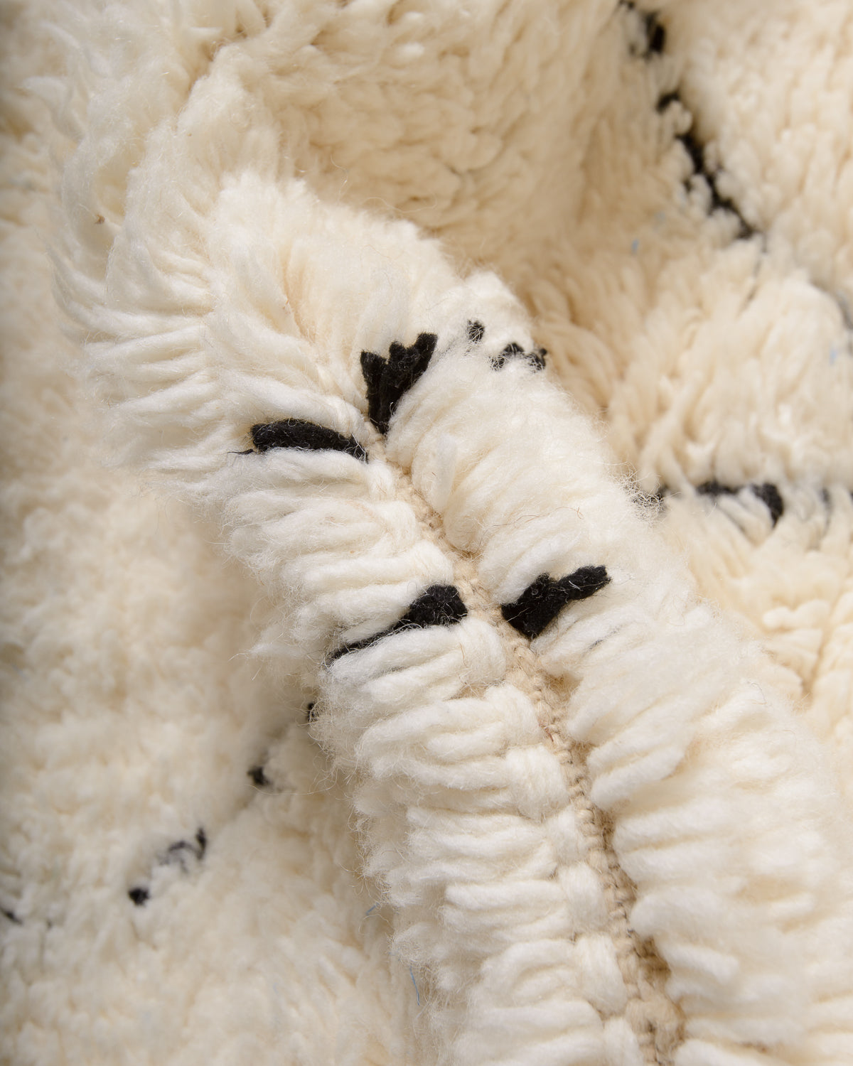 Modern, designer, handcrafted Berber rug from Morocco. Beniourain carpet with minimalist design, natural wool pile and a fluffy texture.