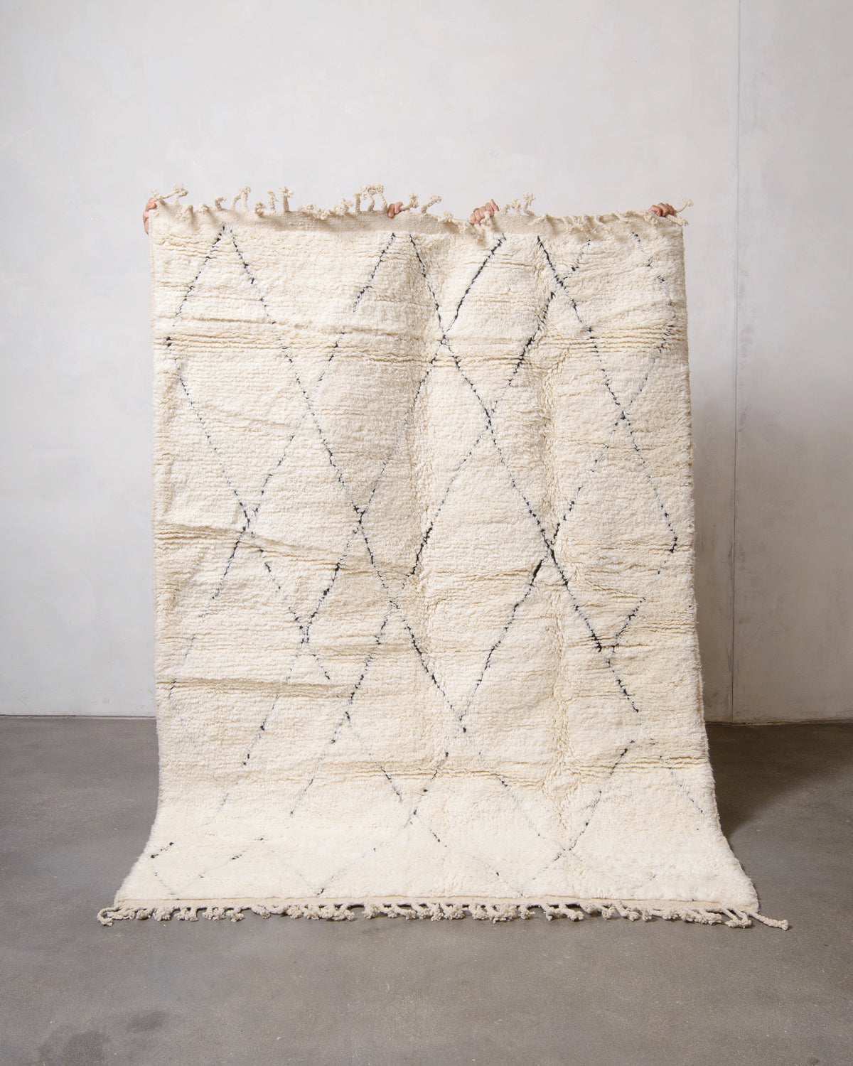 Modern, designer, handcrafted Berber rug from Morocco. Beniourain carpet with minimalist design, natural wool pile and a fluffy texture.