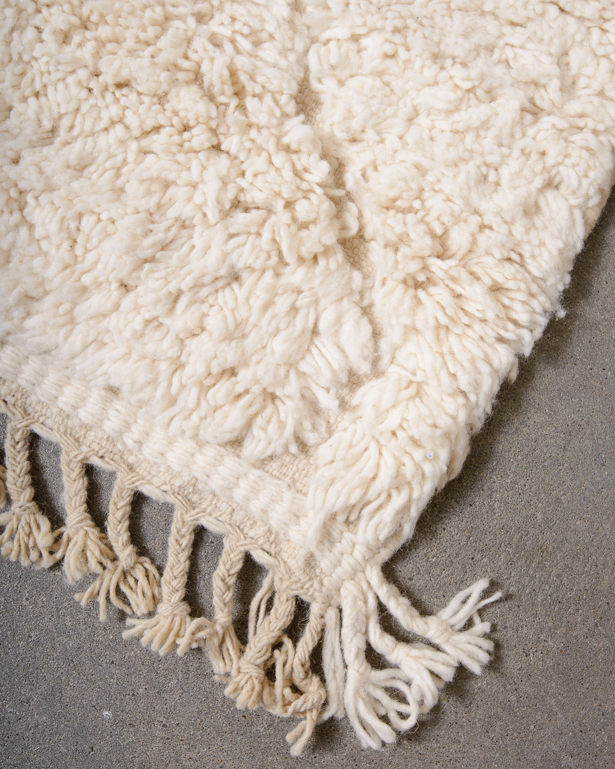 Modern, designer, handcrafted Berber rug from Morocco. Beniourain carpet with minimalist design, natural wool pile and a fluffy texture.