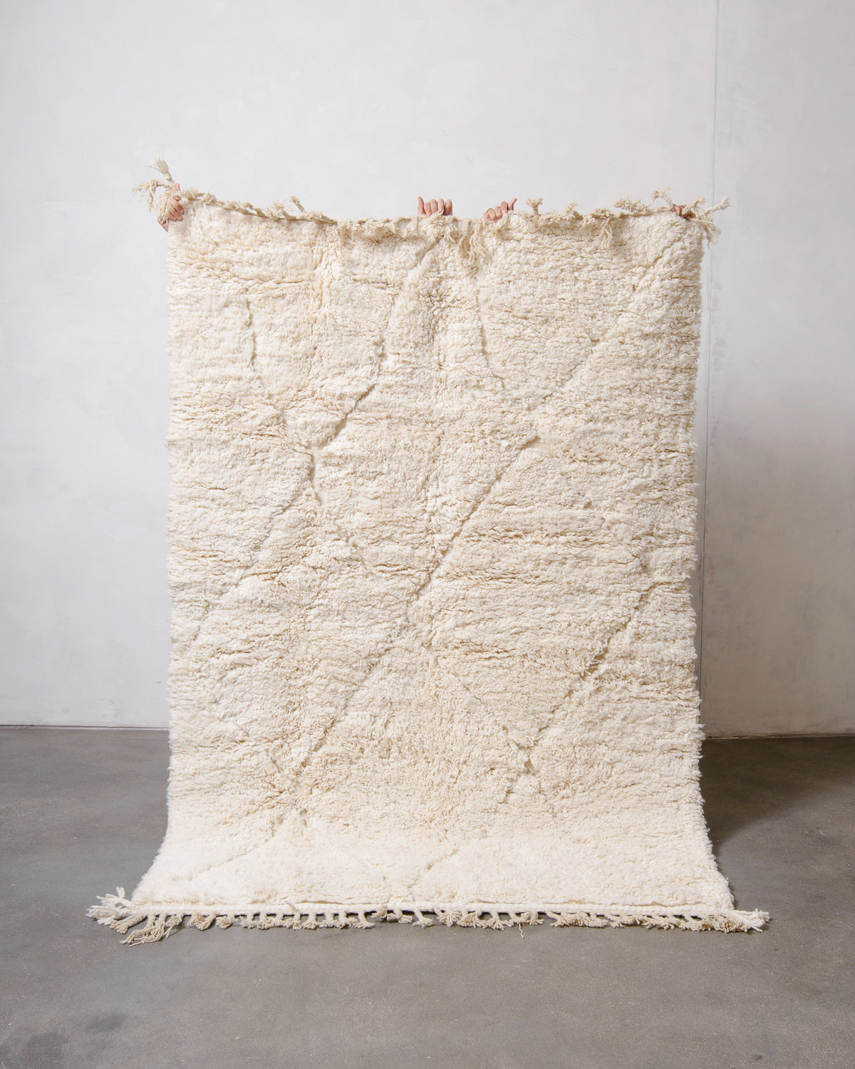 Modern, designer, handcrafted Berber rug from Morocco. Beniourain carpet with minimalist design, natural wool pile and a fluffy texture.