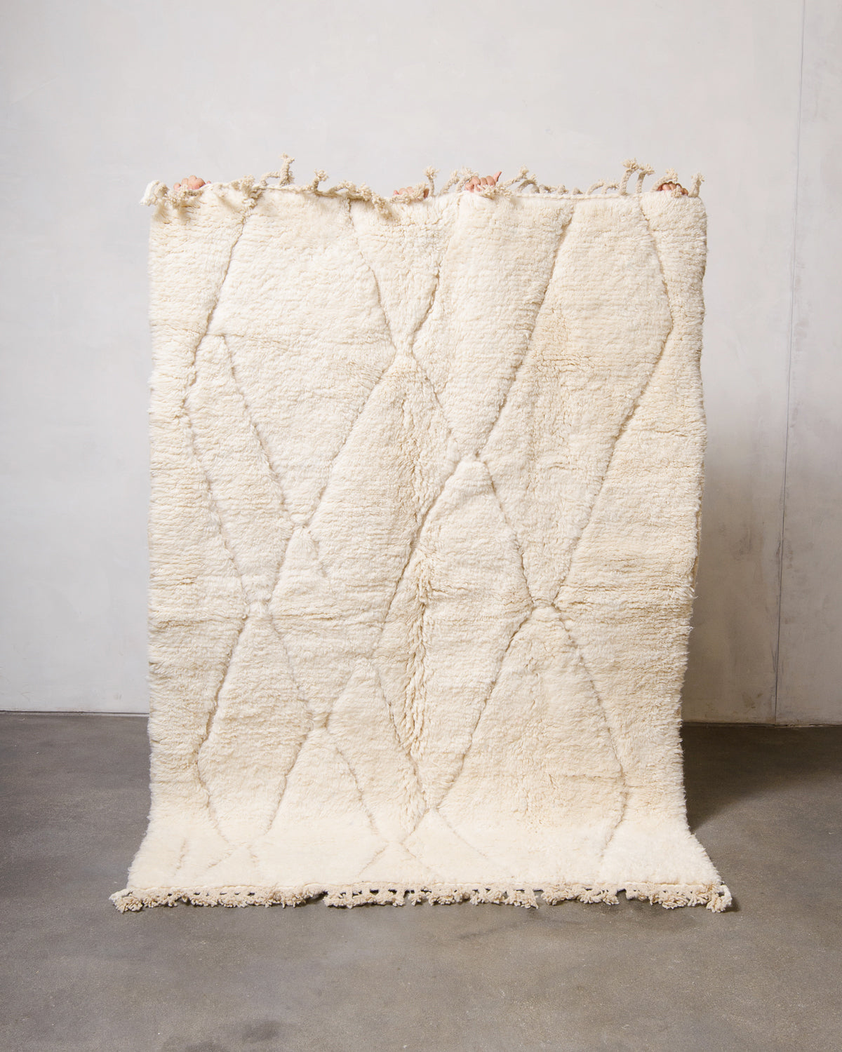 Modern, designer, handcrafted Berber rug from Morocco. Beniourain carpet with minimalist design, natural wool pile and a fluffy texture.