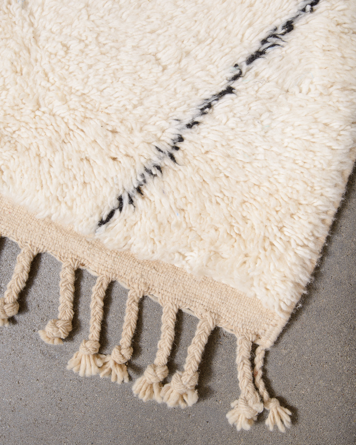 Modern, designer, handcrafted Berber rug from Morocco. Beniourain carpet with minimalist design, natural wool pile and a fluffy texture.