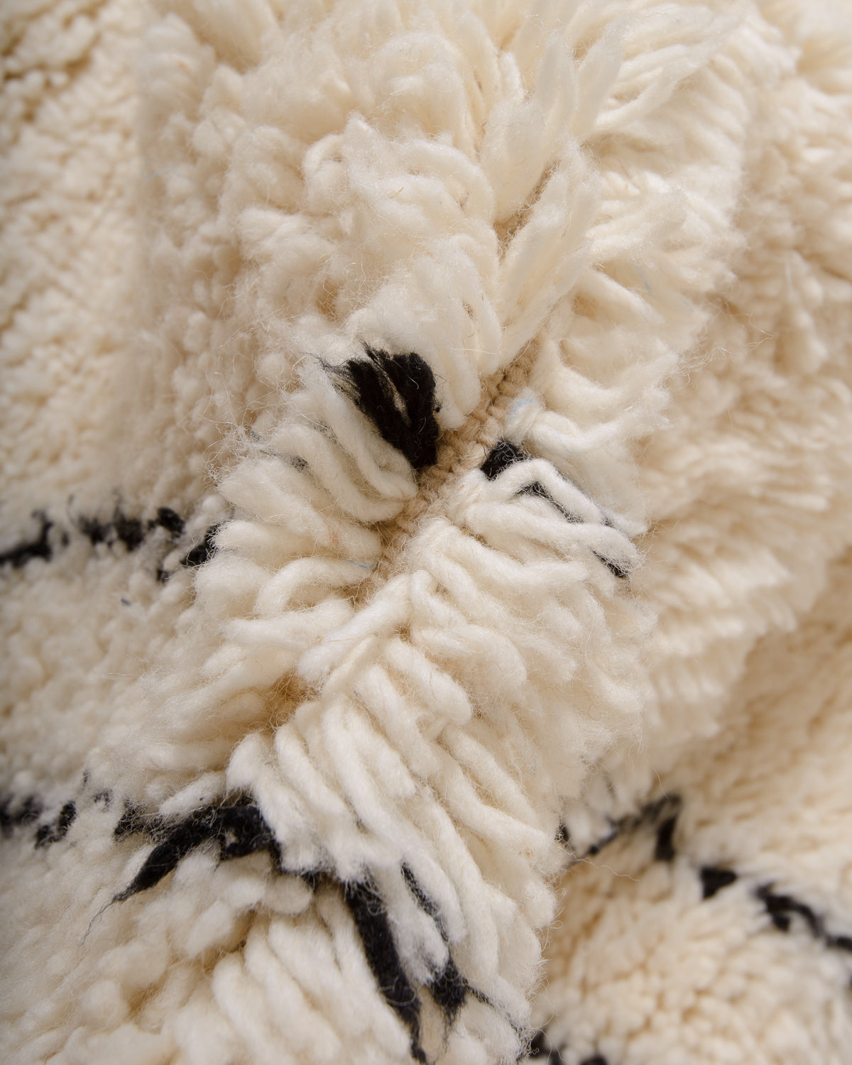 Modern, designer, handcrafted Berber rug from Morocco. Beniourain carpet with minimalist design, natural wool pile and a fluffy texture.