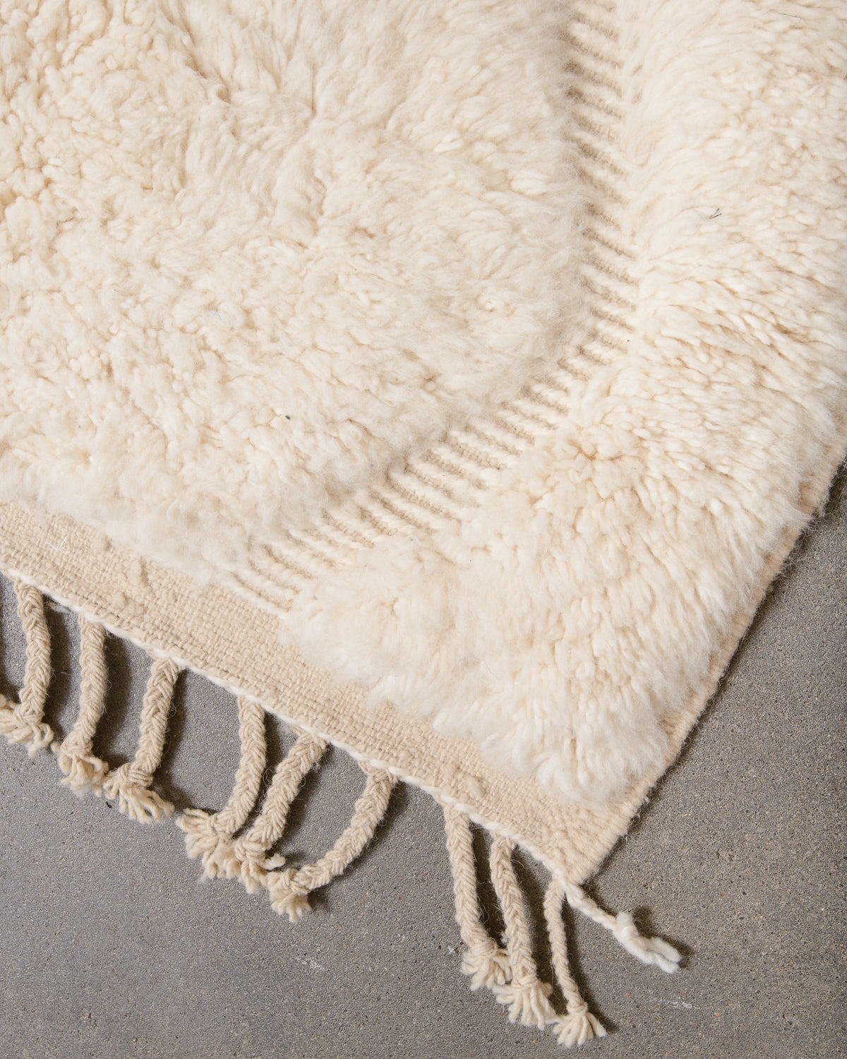 Modern, designer, handcrafted Berber rug from Morocco. Beniourain carpet with minimalist design, natural wool pile and a fluffy texture.