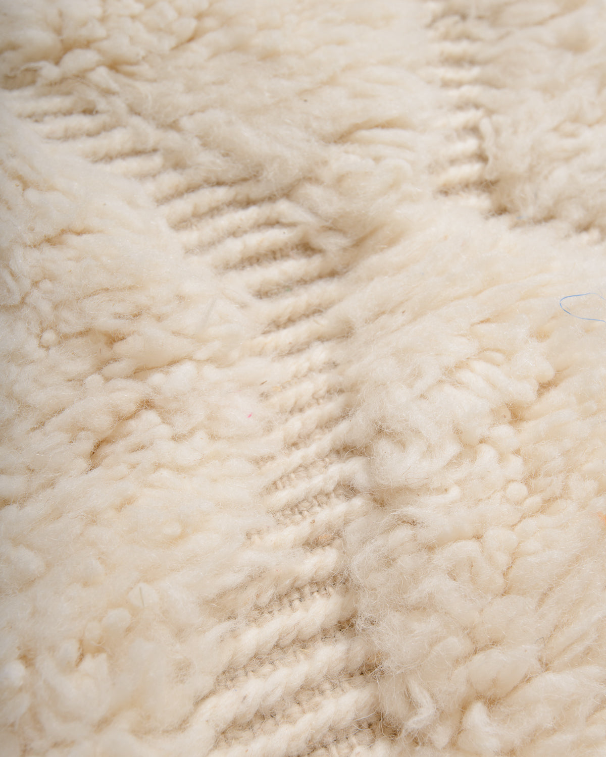 Modern, designer, handcrafted Berber rug from Morocco. Beniourain carpet with minimalist design, natural wool pile and a fluffy texture.