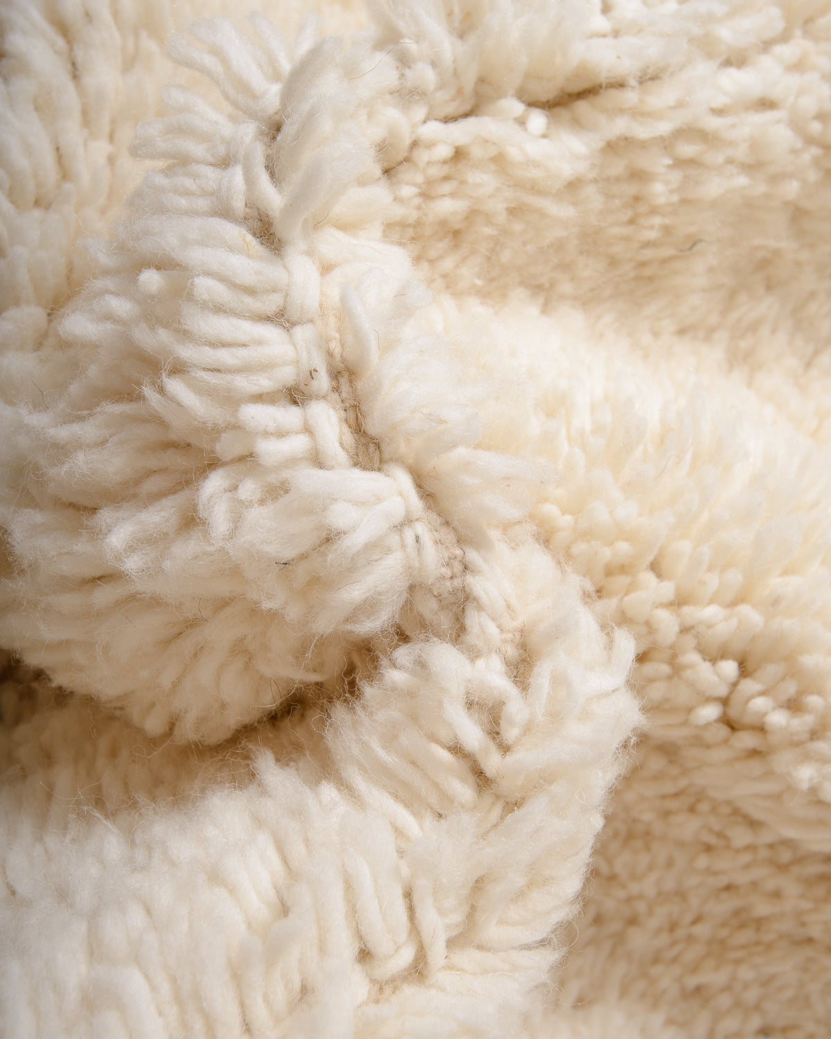 Modern, designer, handcrafted Berber rug from Morocco. Beniourain carpet with minimalist design, natural wool pile and a fluffy texture.