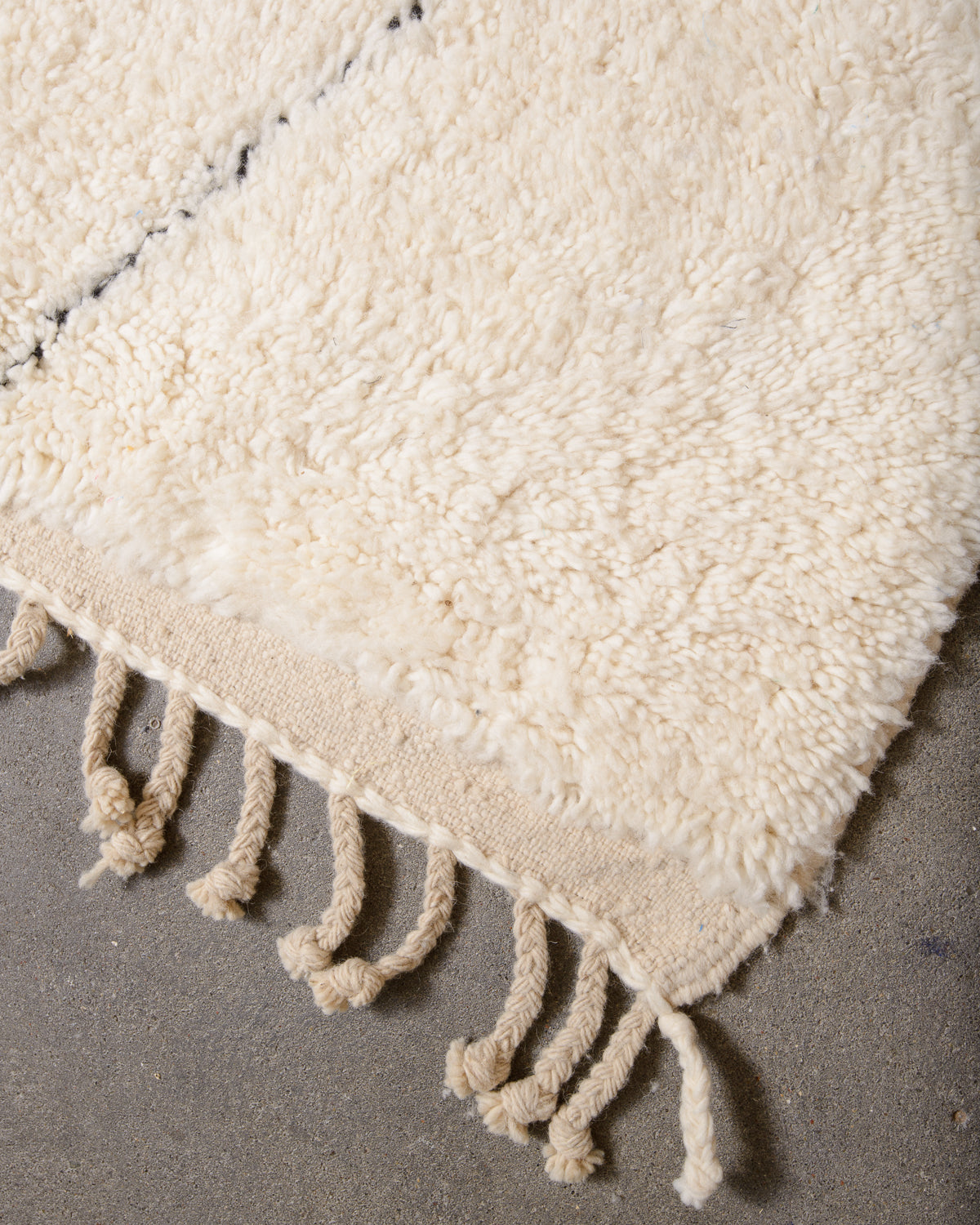 Modern, designer, handcrafted Berber rug from Morocco. Beniourain carpet with minimalist design, natural wool pile and a fluffy texture.
