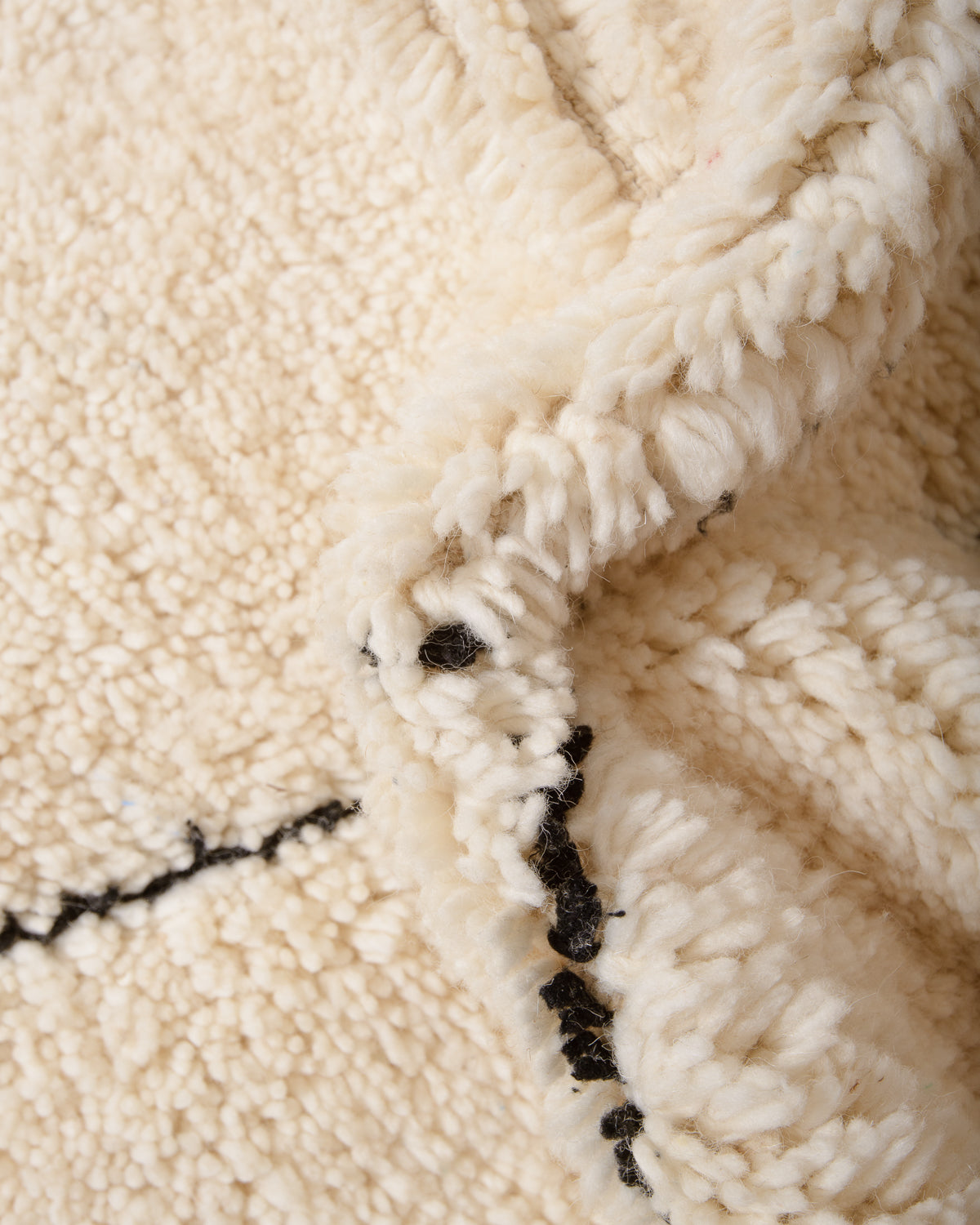 Modern, designer, handcrafted Berber rug from Morocco. Beniourain carpet with minimalist design, natural wool pile and a fluffy texture.