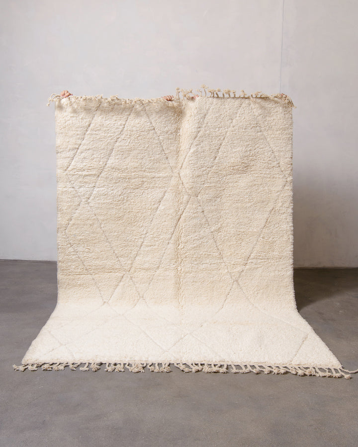 Modern, designer, handcrafted Berber rug from Morocco. Beniourain carpet with minimalist design, natural wool pile and a fluffy texture.