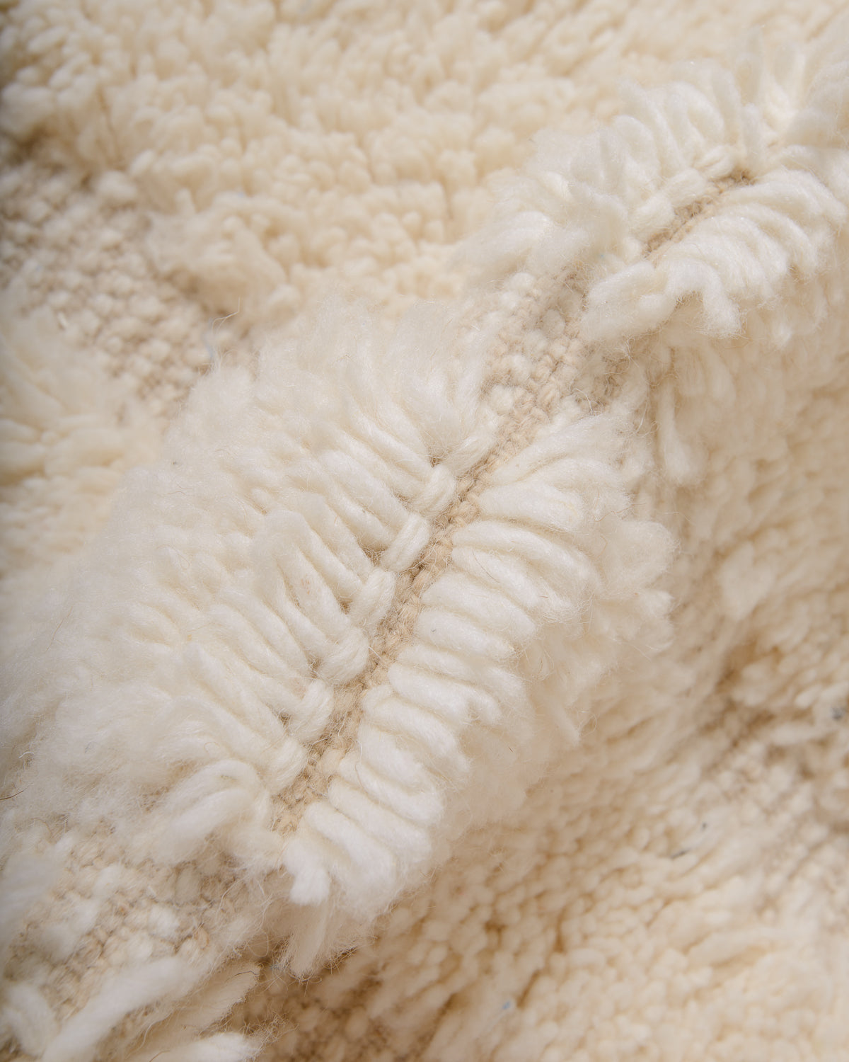 Modern, designer, handcrafted Berber rug from Morocco. Beniourain carpet with minimalist design, natural wool pile and a fluffy texture.