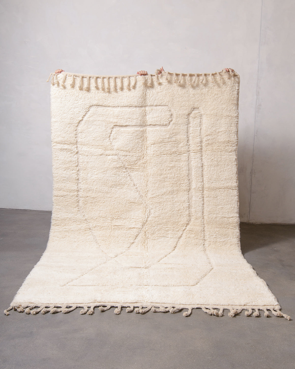 Modern, designer, handcrafted Berber rug from Morocco. Beniourain carpet with minimalist design, natural wool pile and a fluffy texture.