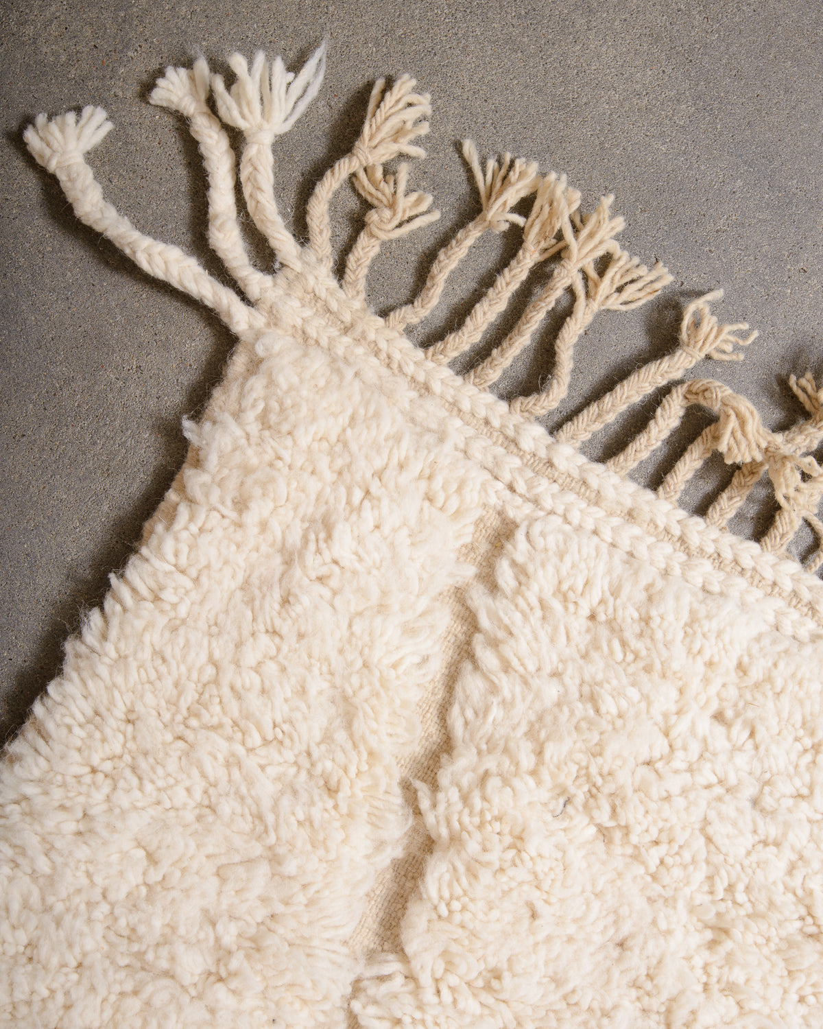Modern, designer, handcrafted Berber rug from Morocco. Beniourain carpet with minimalist design, natural wool pile and a fluffy texture.