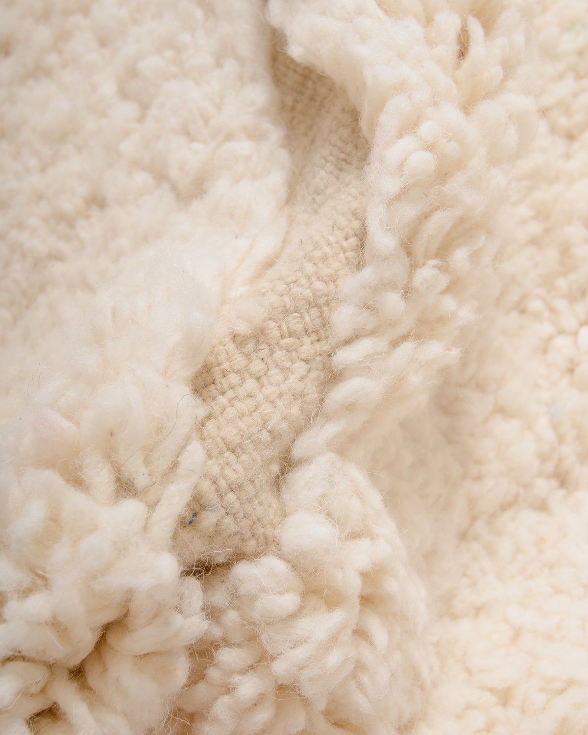 Modern, designer, handcrafted Berber rug from Morocco. Beniourain carpet with minimalist design, natural wool pile and a fluffy texture.