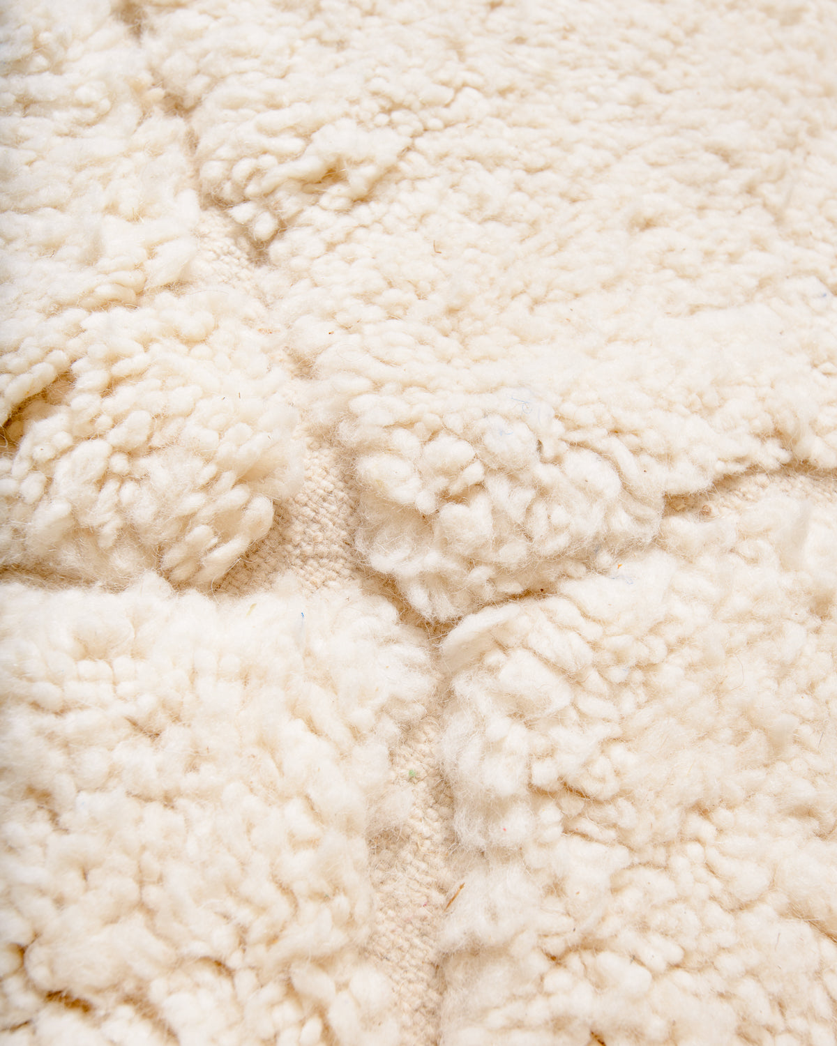 Modern, designer, handcrafted Berber rug from Morocco. Beniourain carpet with minimalist design, natural wool pile and a fluffy texture.