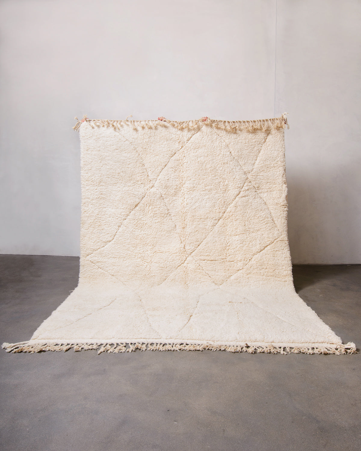 Modern, designer, handcrafted Berber rug from Morocco. Beniourain carpet with minimalist design, natural wool pile and a fluffy texture.