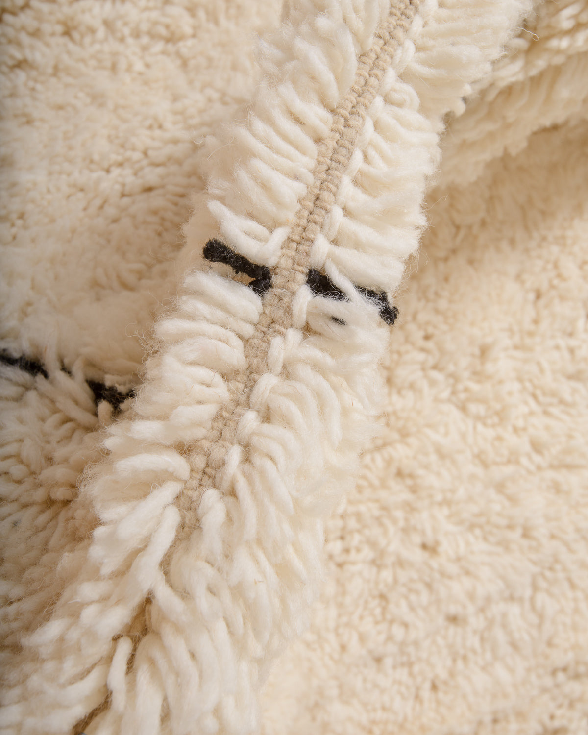 Modern, designer, handcrafted Berber rug from Morocco. Beniourain carpet with minimalist design, natural wool pile and a fluffy texture.