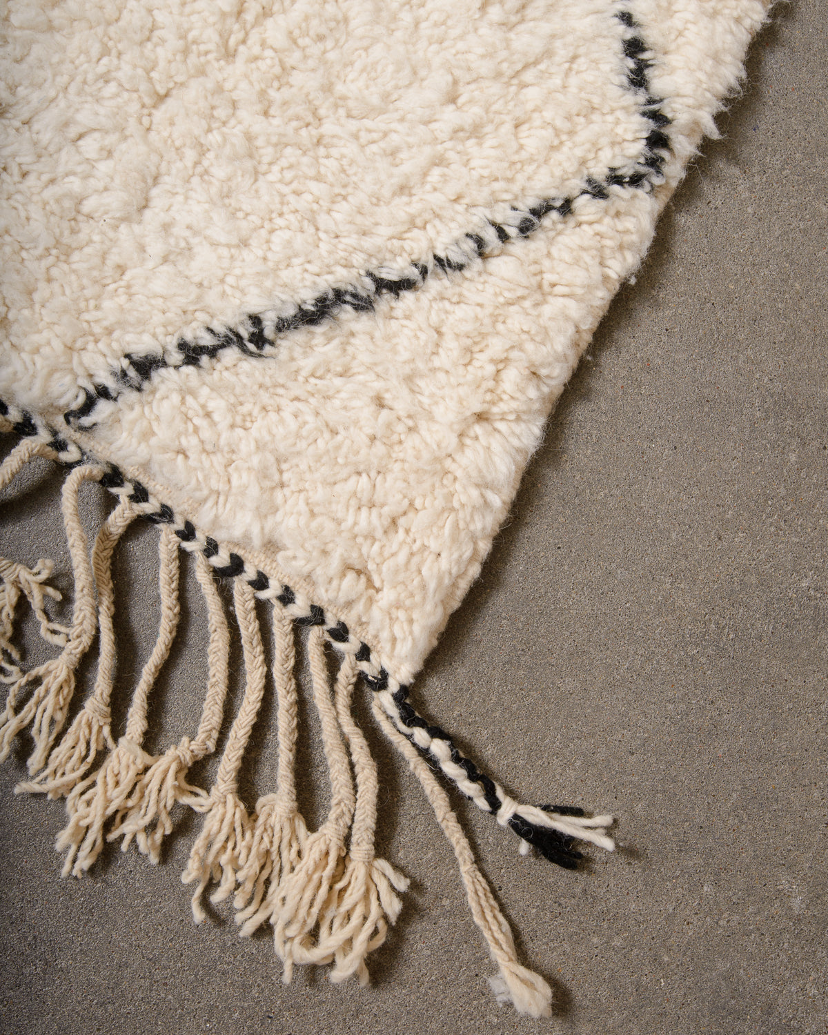 Modern, designer, handcrafted Berber rug from Morocco. Beniourain carpet with minimalist design, natural wool pile and a fluffy texture.
