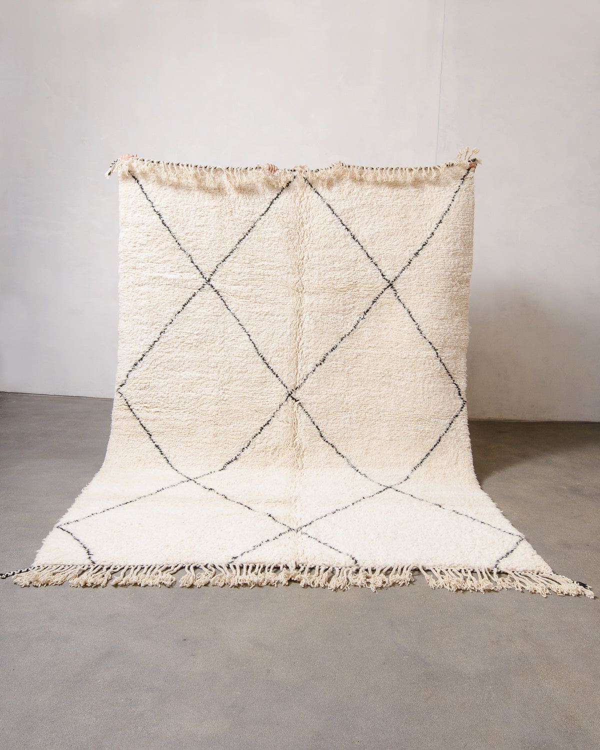 Modern, designer, handcrafted Berber rug from Morocco. Beniourain carpet with minimalist design, natural wool pile and a fluffy texture.