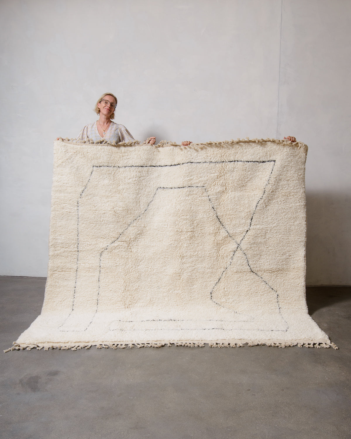 Modern, designer, handcrafted Berber rug from Morocco. Beniourain carpet with minimalist design, natural wool pile and a fluffy texture.