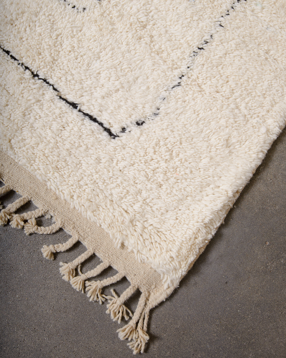 Modern, designer, handcrafted Berber rug from Morocco. Beniourain carpet with minimalist design, natural wool pile and a fluffy texture.