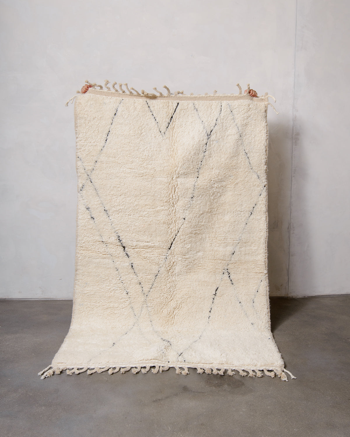 Modern, designer, handcrafted Berber rug from Morocco. Beniourain carpet with minimalist design, natural wool pile and a fluffy texture.