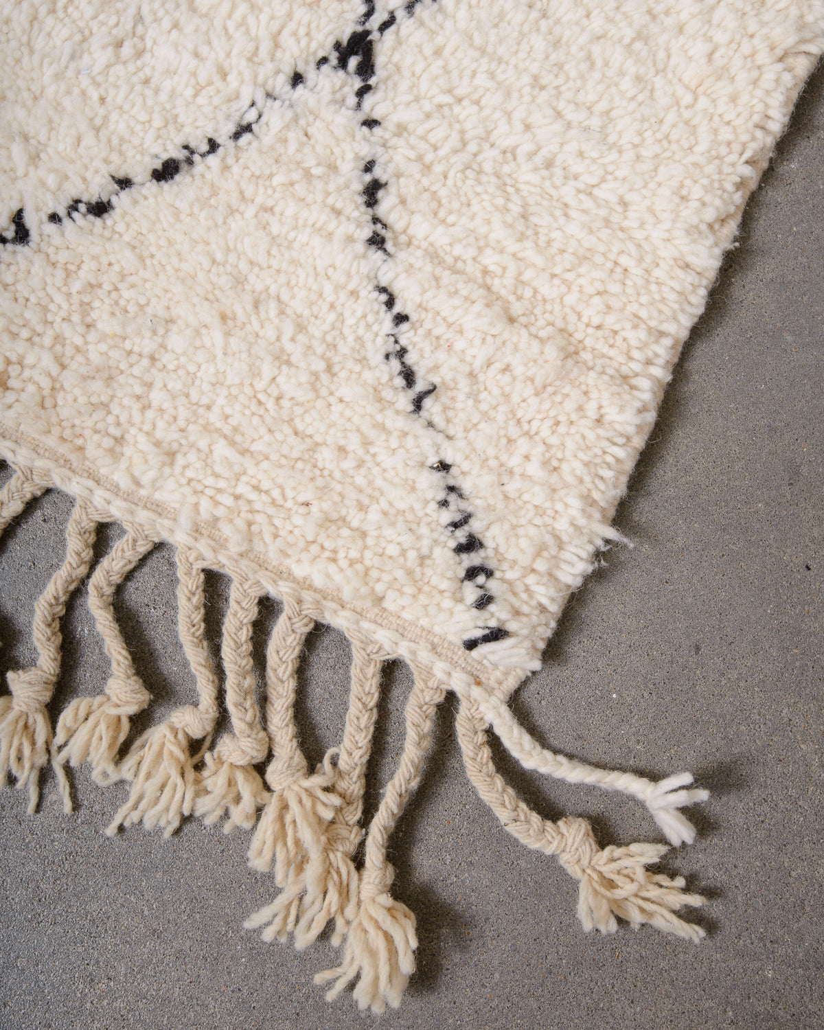 Modern, designer, handcrafted Berber rug from Morocco. Beniourain carpet with minimalist design, natural wool pile and a fluffy texture.