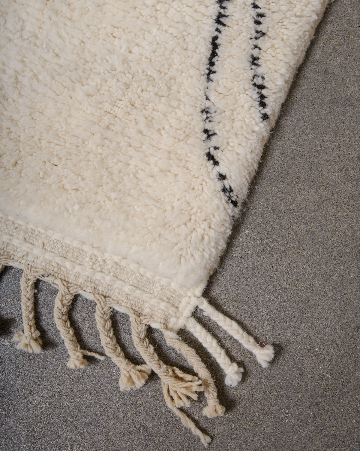 Modern, designer, handcrafted Berber rug from Morocco. Beniourain carpet with minimalist design, natural wool pile and a fluffy texture.