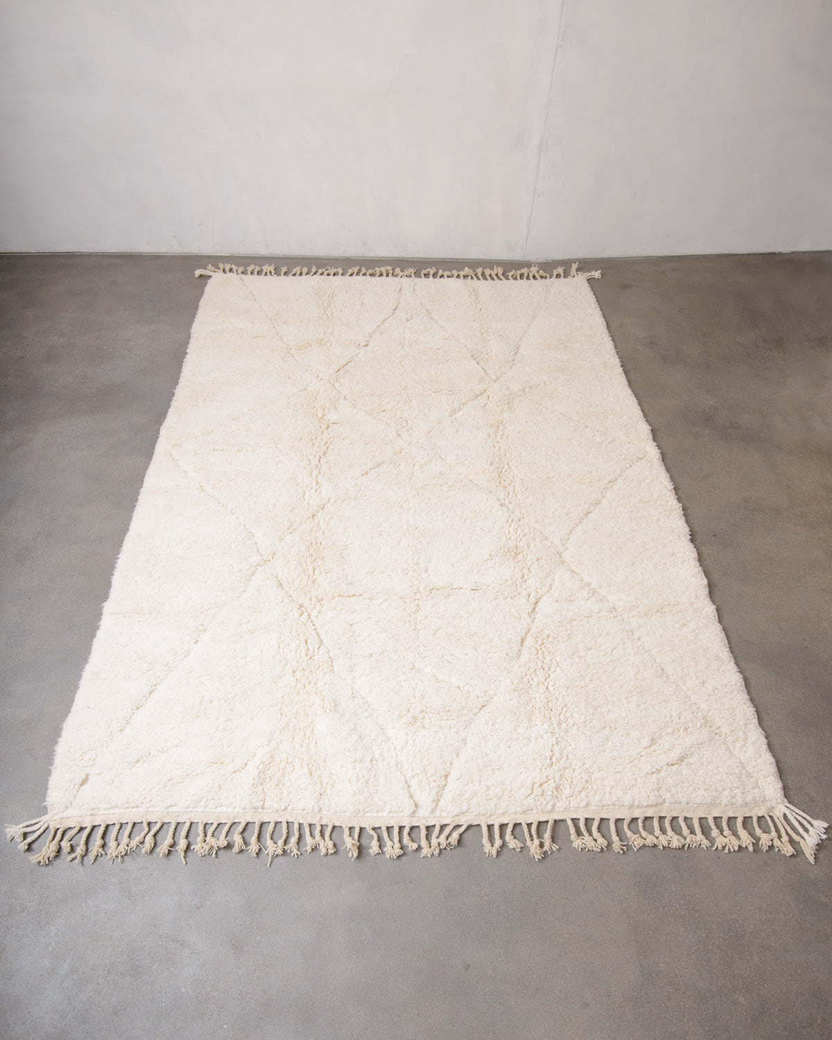 Modern, designer, handcrafted Berber rug from Morocco. Beniourain carpet with minimalist design, natural wool pile and a fluffy texture.