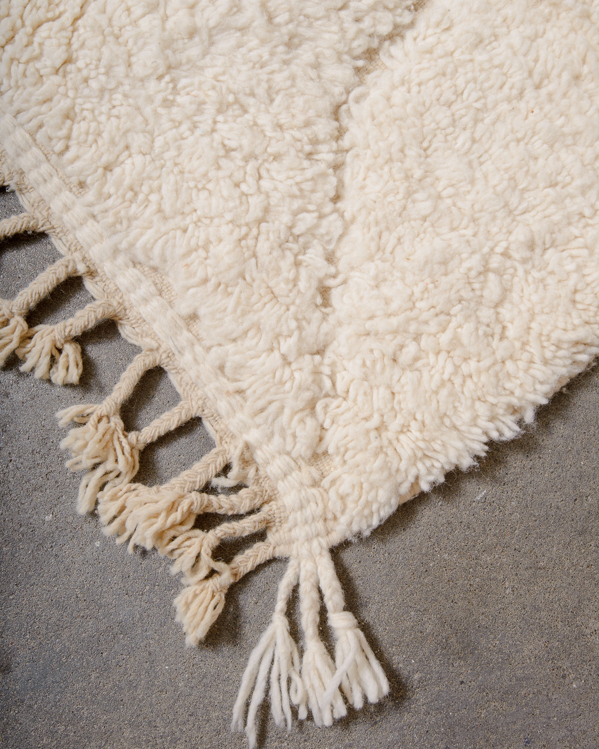 Modern, designer, handcrafted Berber rug from Morocco. Beniourain carpet with minimalist design, natural wool pile and a fluffy texture.