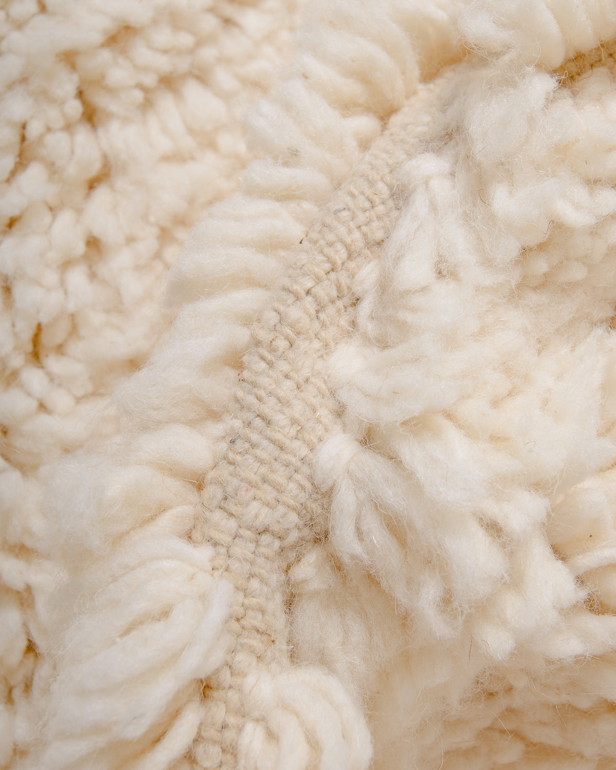 Modern, designer, handcrafted Berber rug from Morocco. Beniourain carpet with minimalist design, natural wool pile and a fluffy texture.