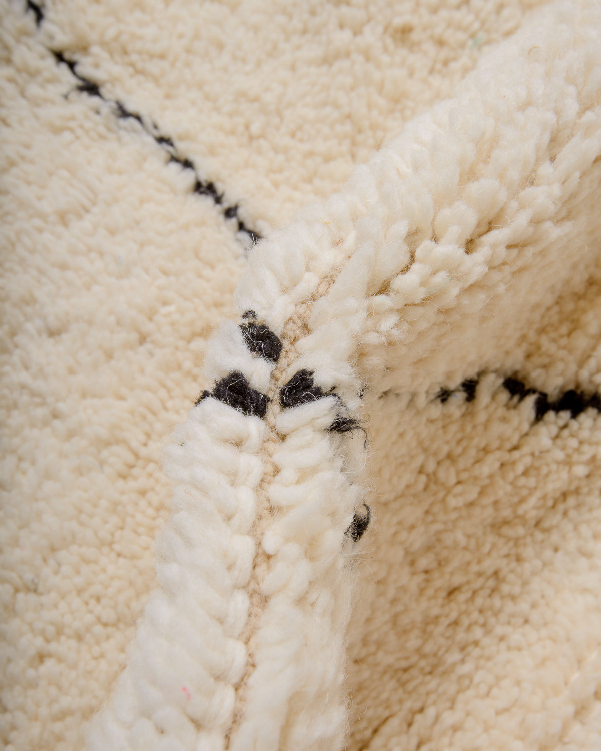 Modern, designer, handcrafted Berber rug from Morocco. Beniourain carpet with minimalist design, natural wool pile and a fluffy texture.