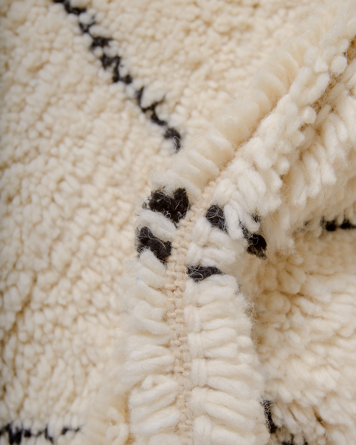 Modern, designer, handcrafted Berber rug from Morocco. Beniourain carpet with minimalist design, natural wool pile and a fluffy texture.