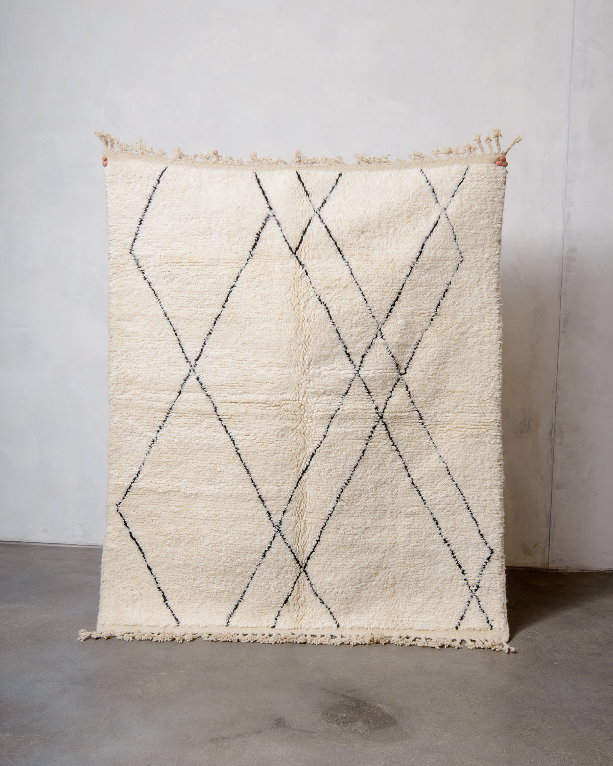 Modern, designer, handcrafted Berber rug from Morocco. Beniourain carpet with minimalist design, natural wool pile and a fluffy texture.