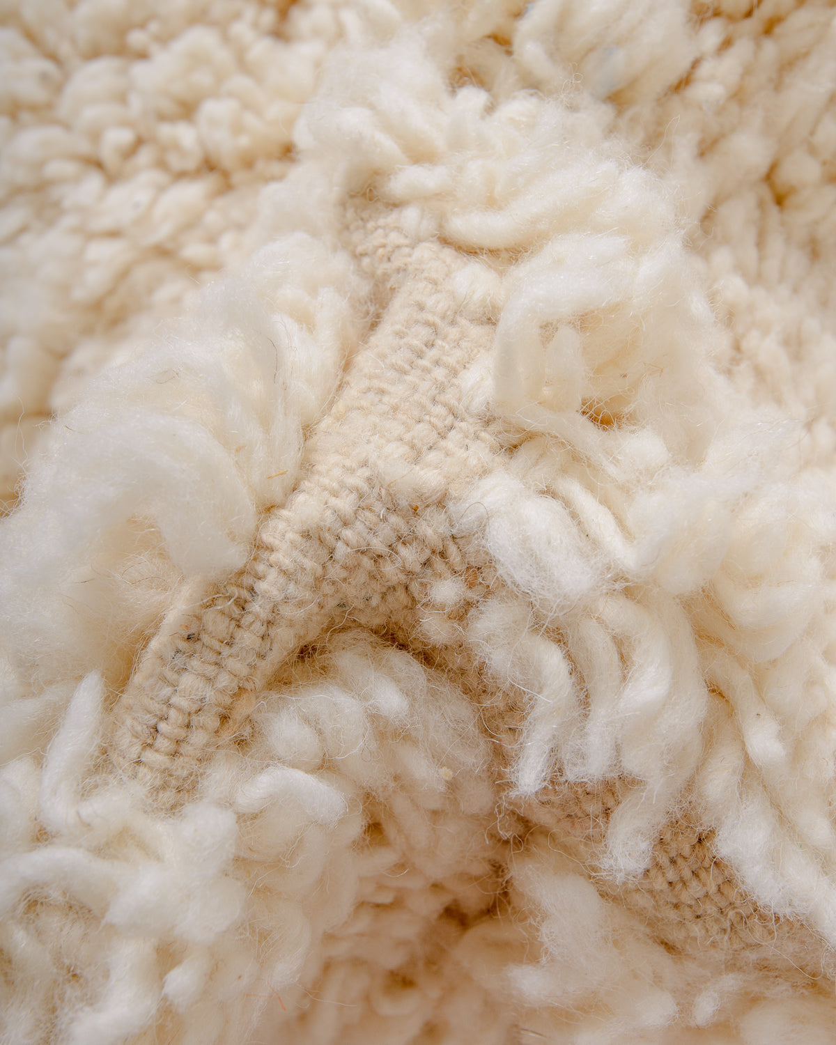 Modern, designer, handcrafted Berber rug from Morocco. Beniourain carpet with minimalist design, natural wool pile and a fluffy texture.