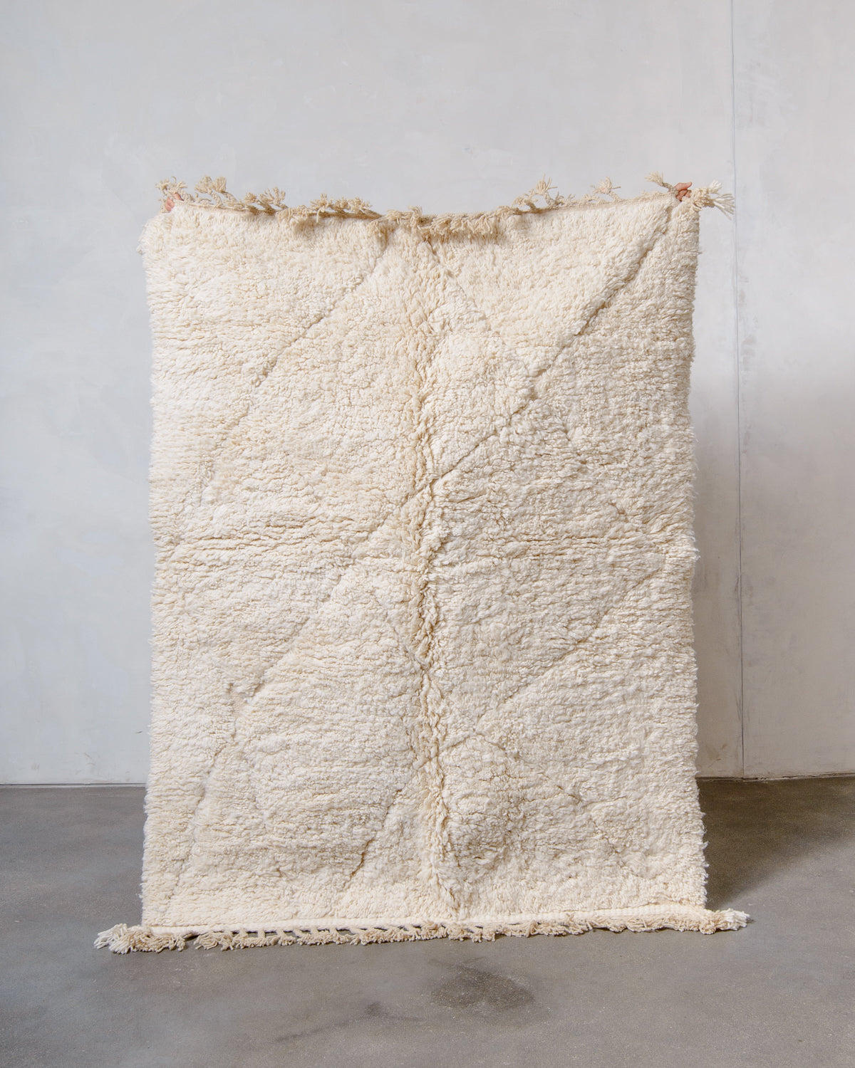 Modern, designer, handcrafted Berber rug from Morocco. Beniourain carpet with minimalist design, natural wool pile and a fluffy texture.