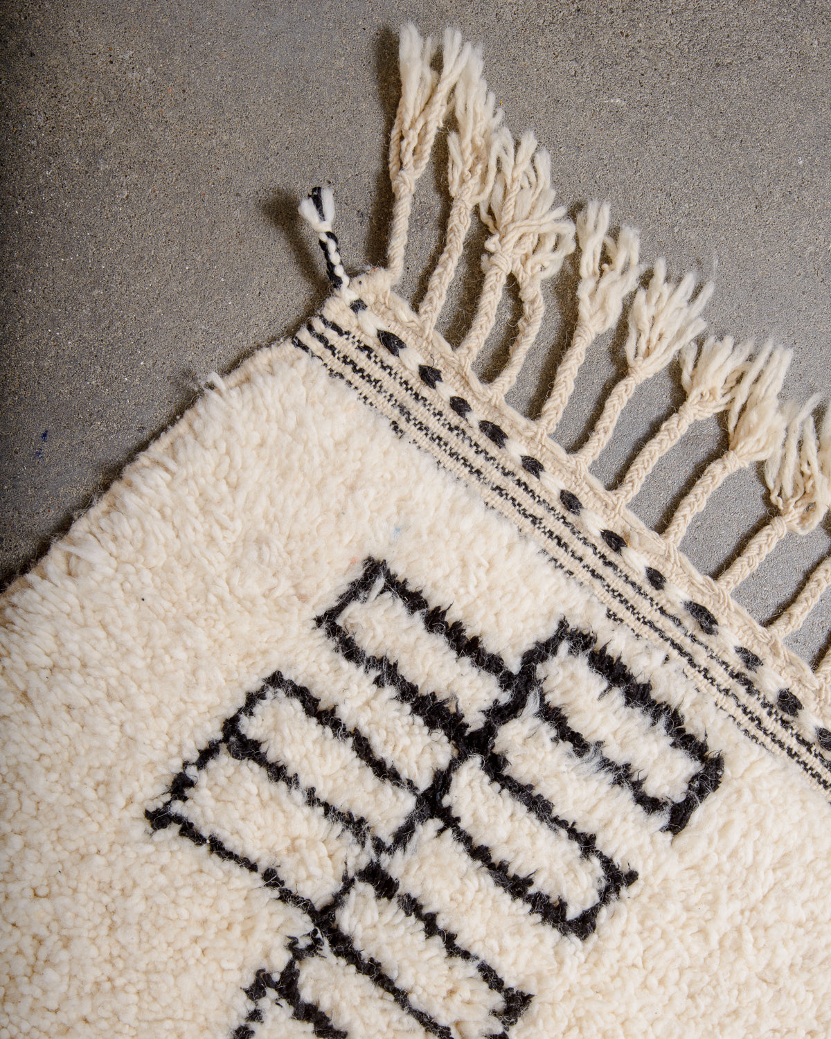Modern, designer, handcrafted Berber rug from Morocco. Beniourain carpet with minimalist design, natural wool pile and a fluffy texture.