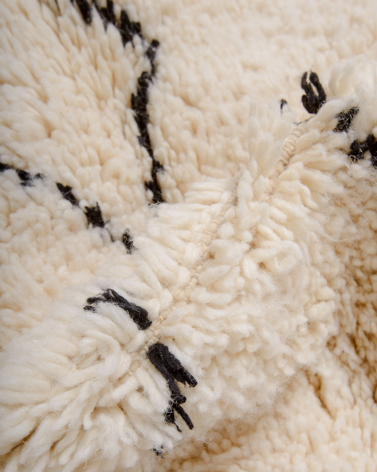 Modern, designer, handcrafted Berber rug from Morocco. Beniourain carpet with minimalist design, natural wool pile and a fluffy texture.