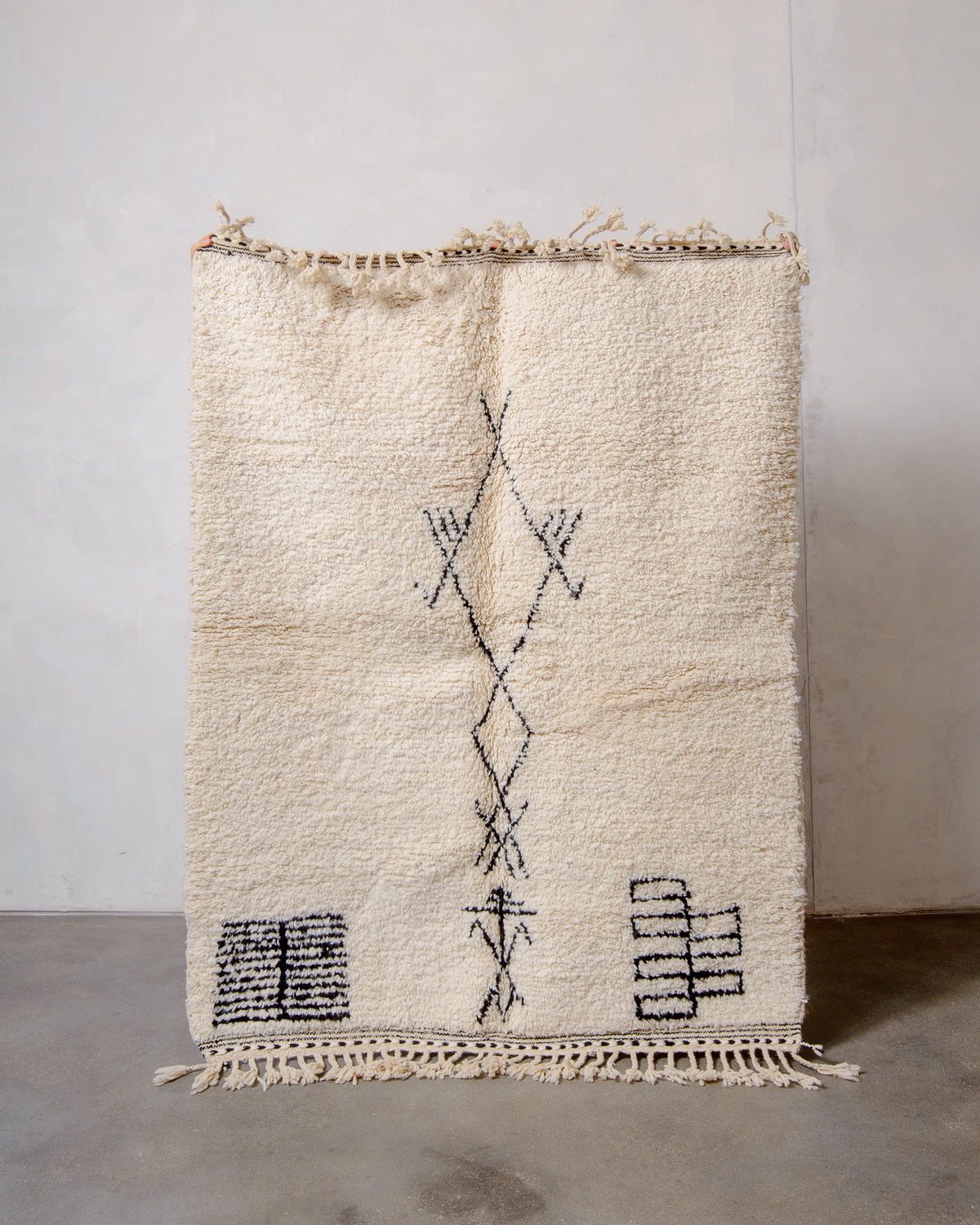 Modern, designer, handcrafted Berber rug from Morocco. Beniourain carpet with minimalist design, natural wool pile and a fluffy texture.