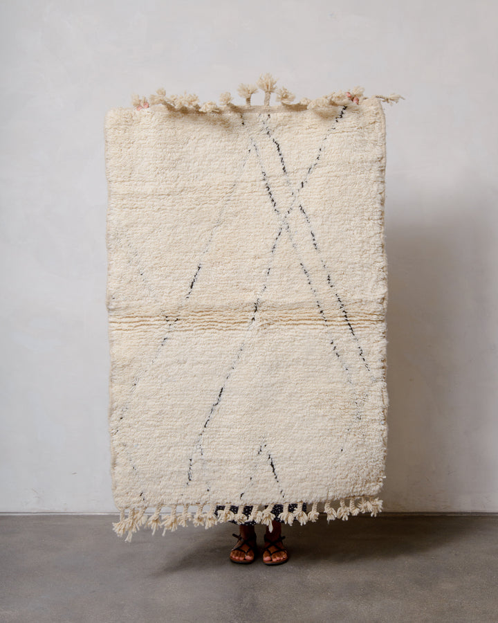 Modern, designer, handcrafted Berber rug from Morocco. Beniourain carpet with minimalist design, natural wool pile and a fluffy texture.