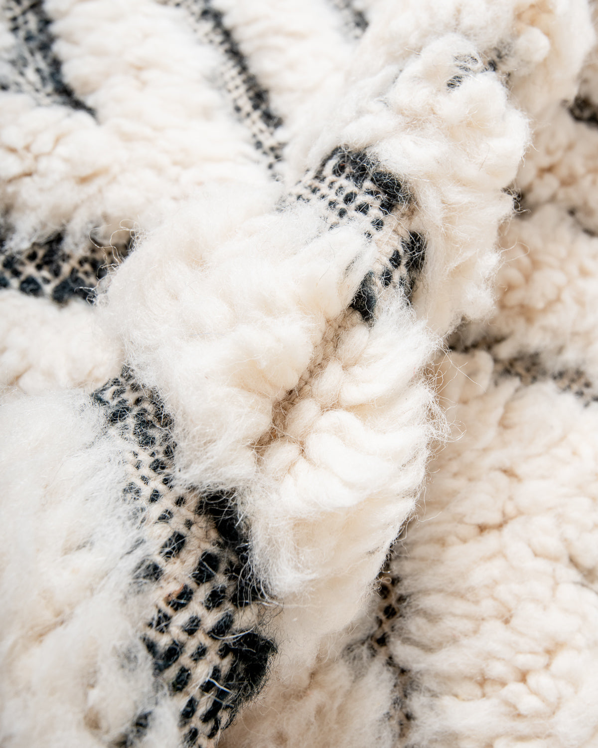 Modern, designer, handcrafted Berber rug from Morocco. Beniourain carpet with minimalist design, natural wool pile and a fluffy texture.