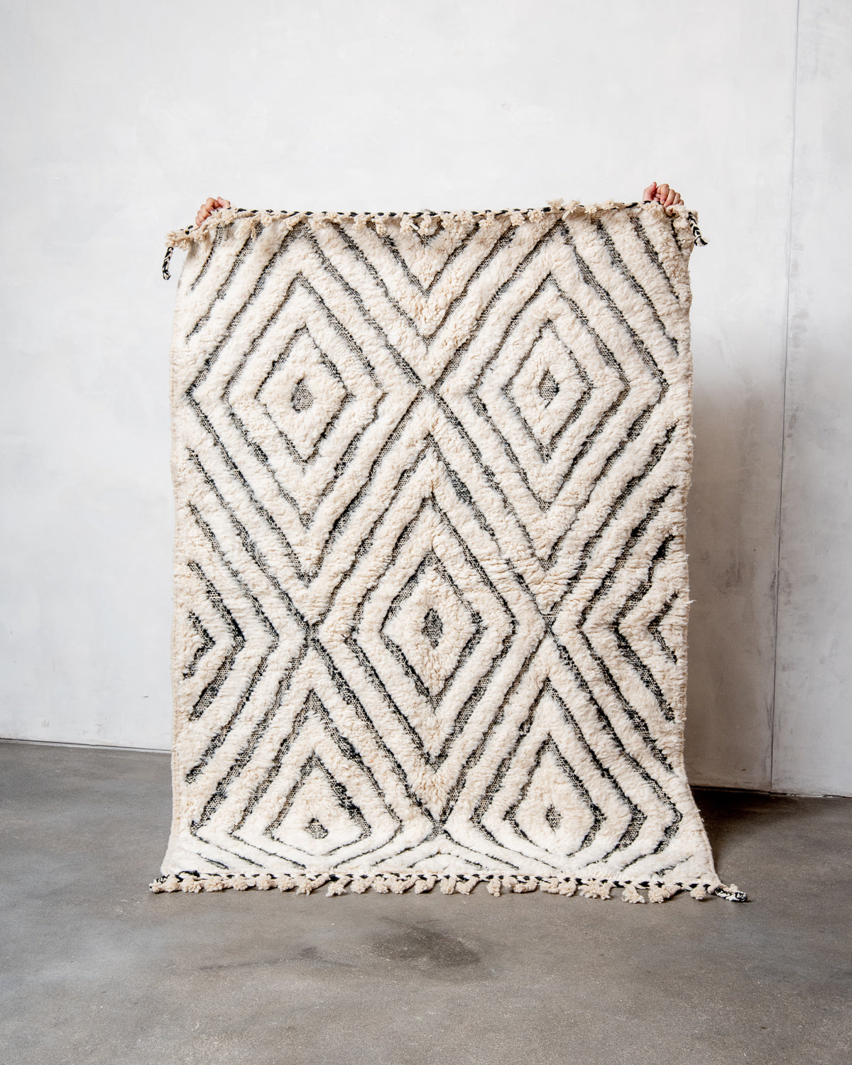 Modern, designer, handcrafted Berber rug from Morocco. Beniourain carpet with minimalist design, natural wool pile and a fluffy texture.