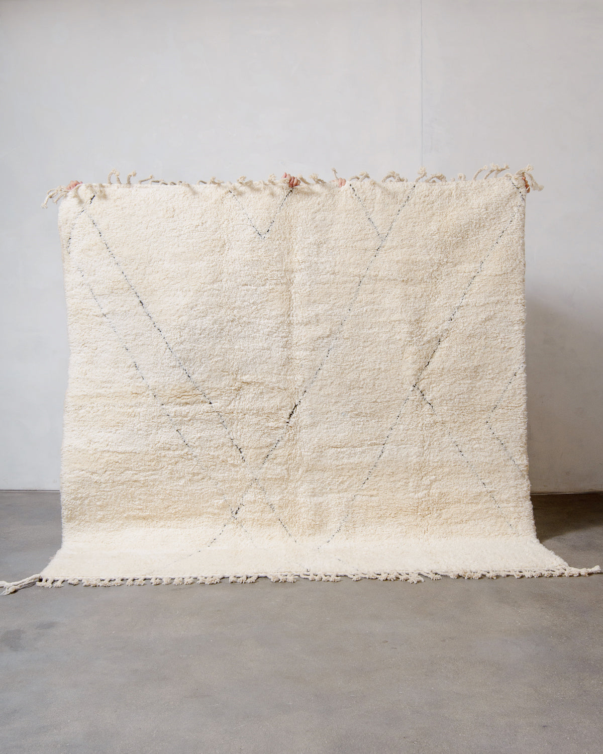 Modern, designer, handcrafted Berber rug from Morocco. Beniourain carpet with minimalist design, natural wool pile and a fluffy texture.