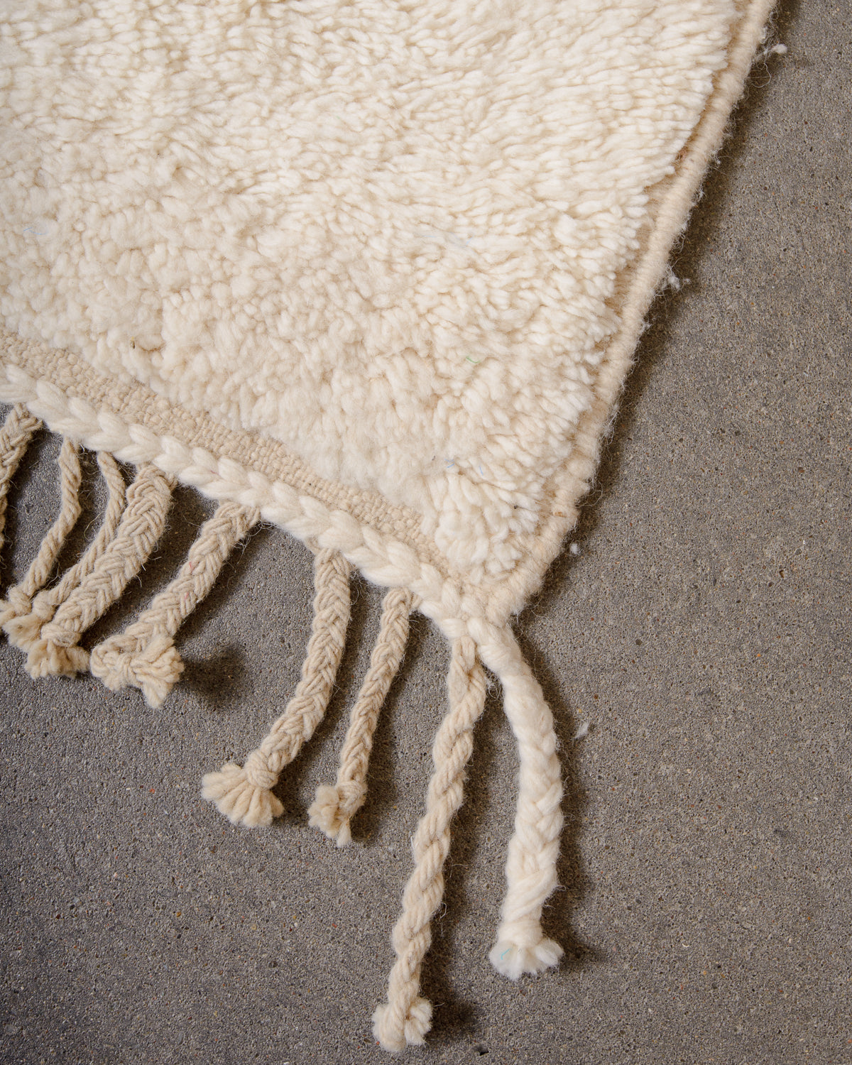 Modern, designer, handcrafted Berber rug from Morocco. Beniourain carpet with minimalist design, natural wool pile and a fluffy texture.