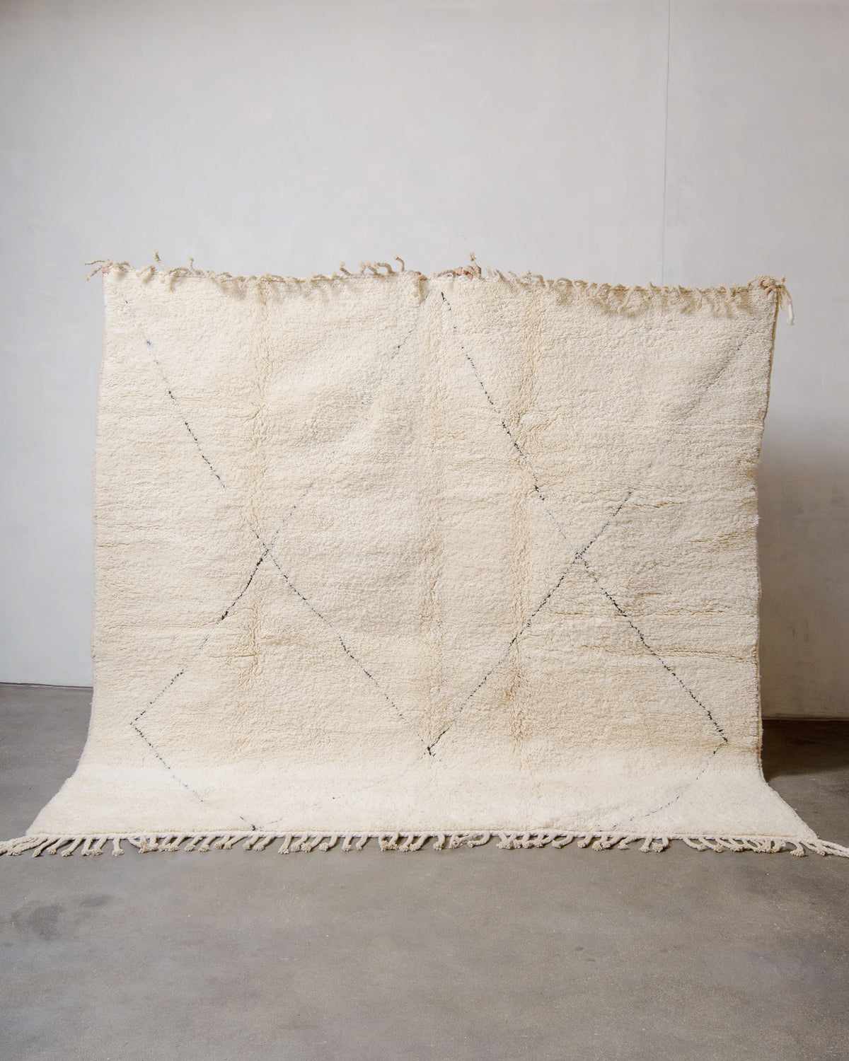 Modern, designer, handcrafted Berber rug from Morocco. Beniourain carpet with minimalist design, natural wool pile and a fluffy texture.