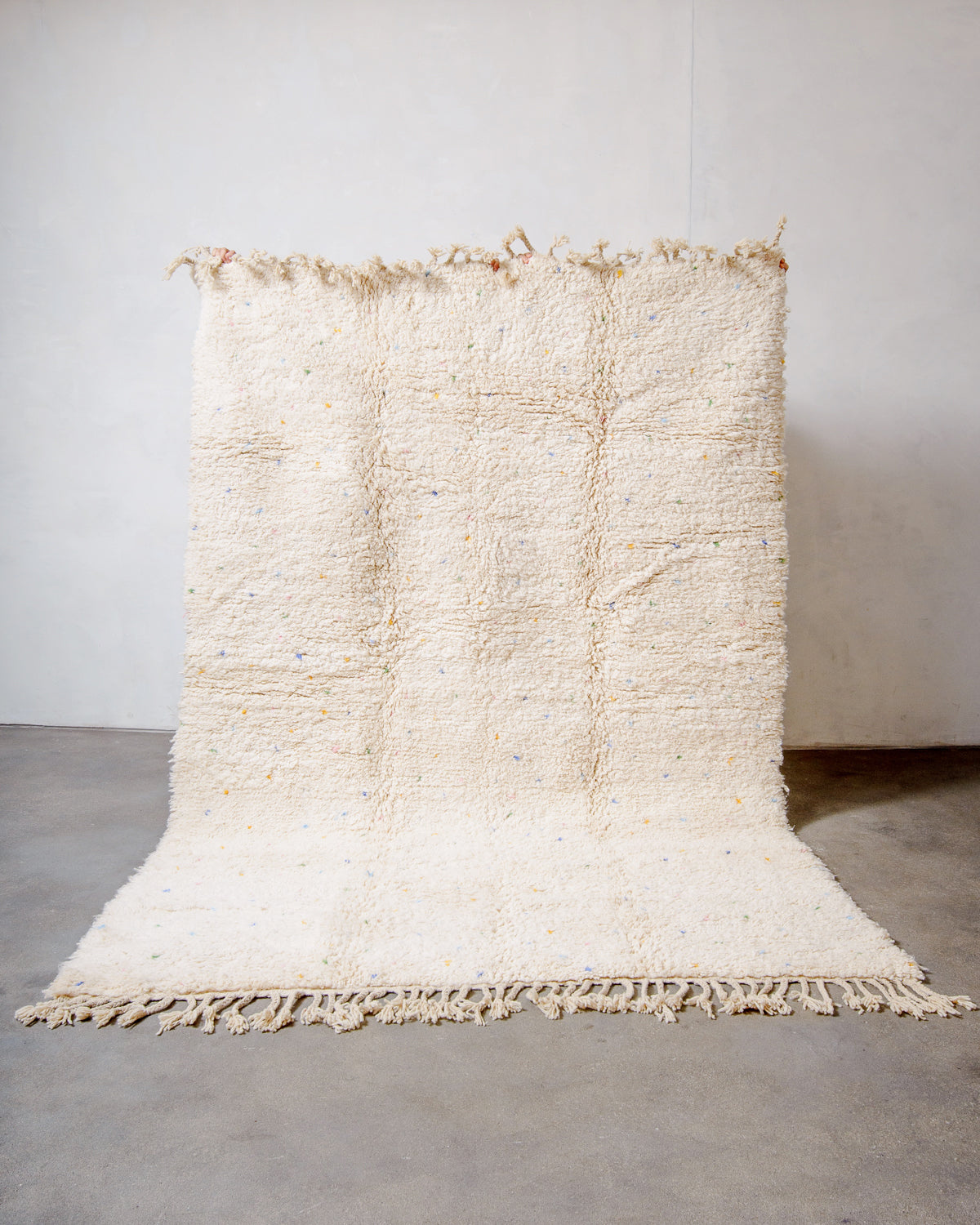 Modern, designer, handcrafted Berber rug from Morocco. Beniourain carpet with minimalist design, natural wool pile and a fluffy texture.