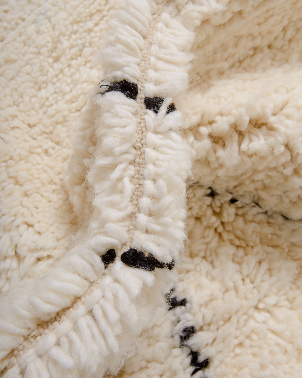 Modern, designer, handcrafted Berber rug from Morocco. Beniourain carpet with minimalist design, natural wool pile and a fluffy texture.