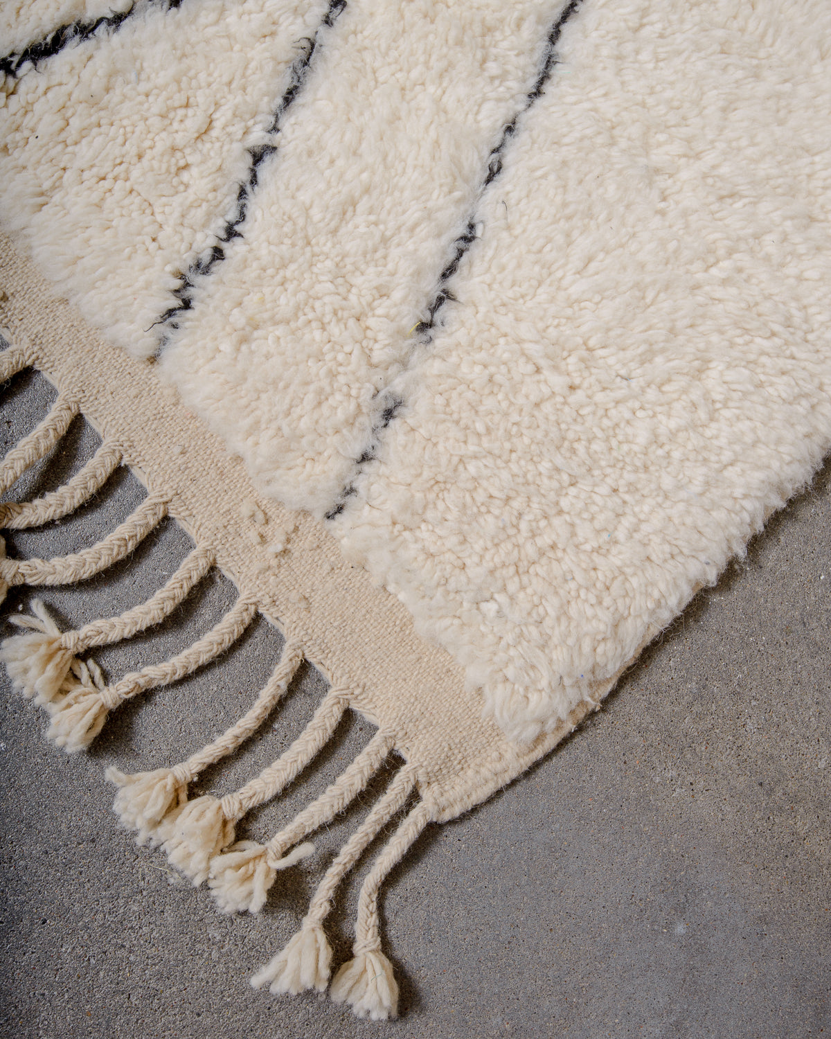 Modern, designer, handcrafted Berber rug from Morocco. Beniourain carpet with minimalist design, natural wool pile and a fluffy texture.