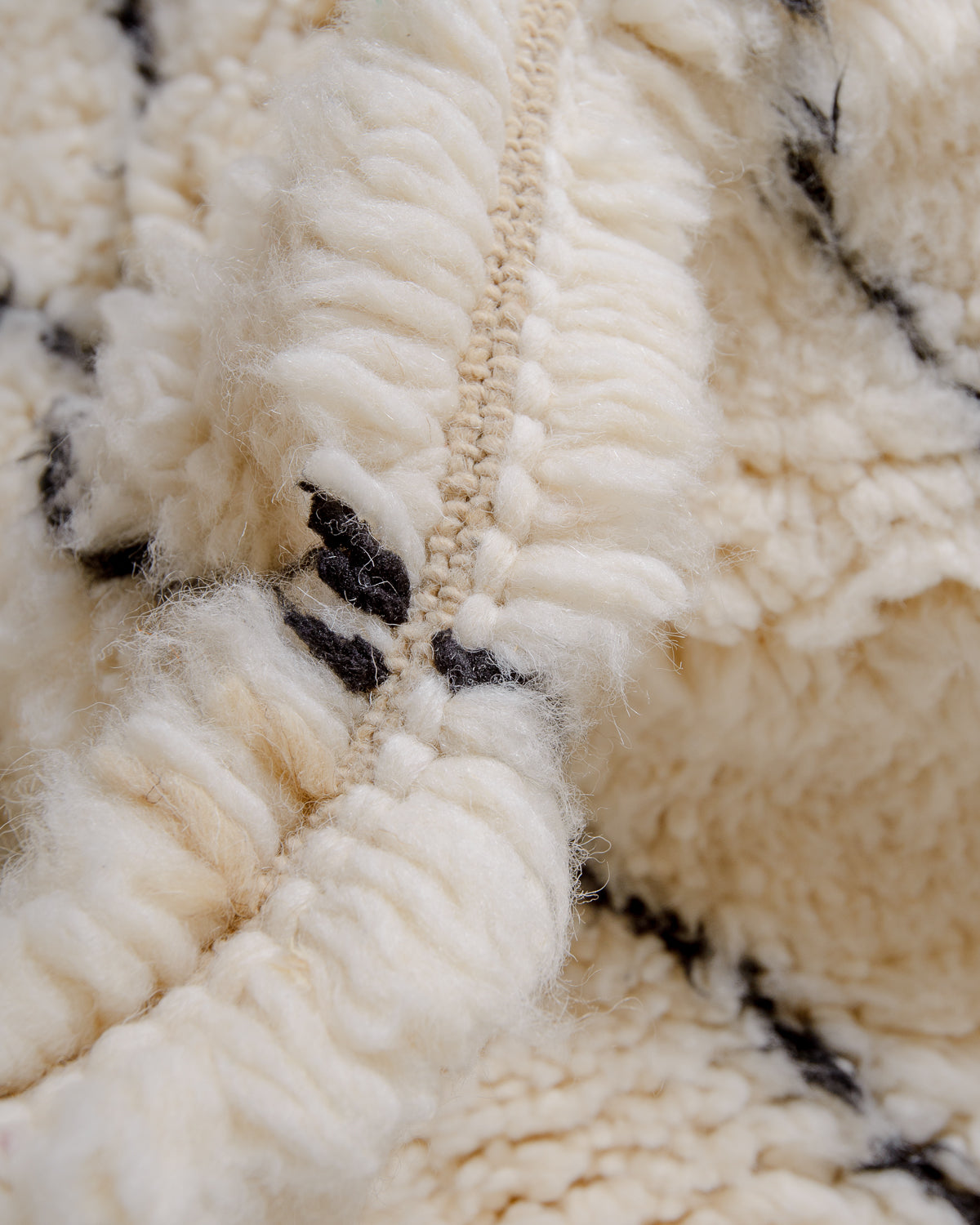 Modern, designer, handcrafted Berber rug from Morocco. Beniourain carpet with minimalist design, natural wool pile and a fluffy texture.