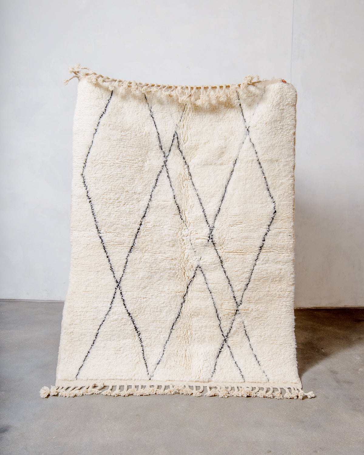 Modern, designer, handcrafted Berber rug from Morocco. Beniourain carpet with minimalist design, natural wool pile and a fluffy texture.