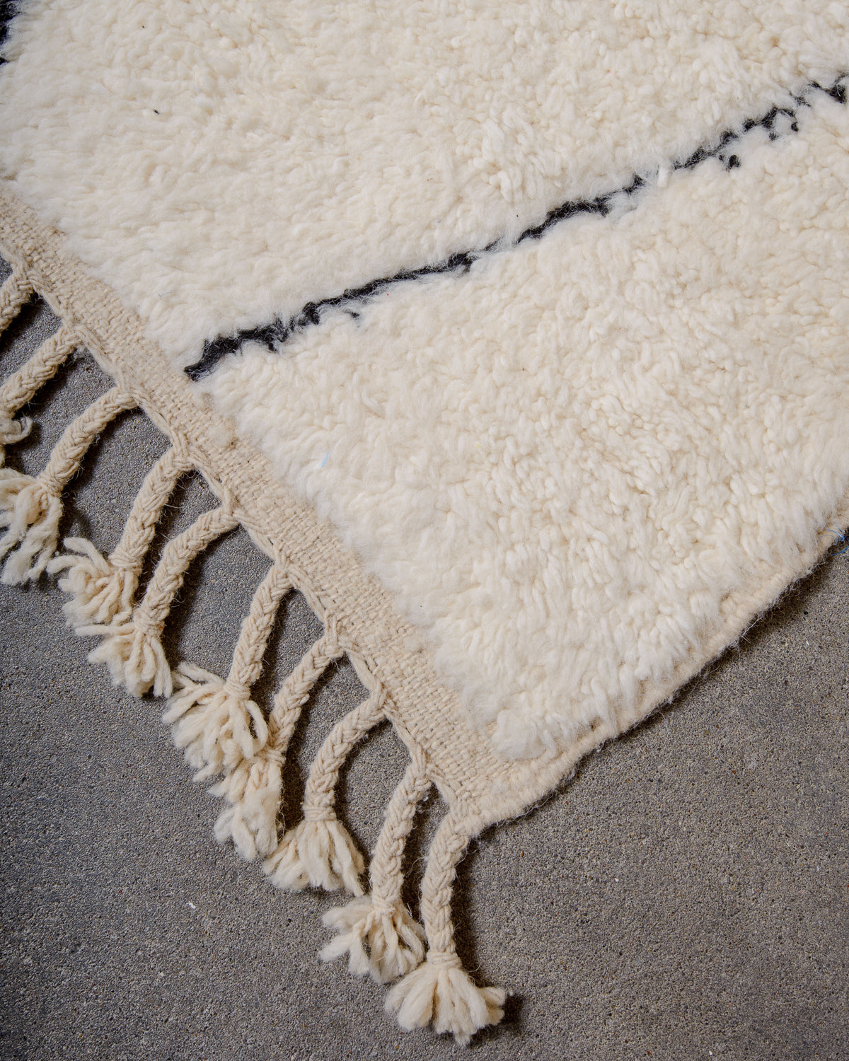 Modern, designer, handcrafted Berber rug from Morocco. Beniourain carpet with minimalist design, natural wool pile and a fluffy texture.